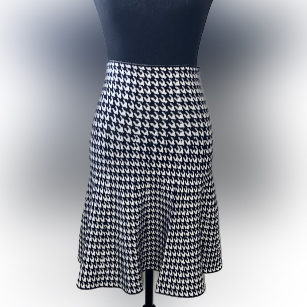 Never worn black and white stretch skirt. High waist. Fits sizes small & medium.